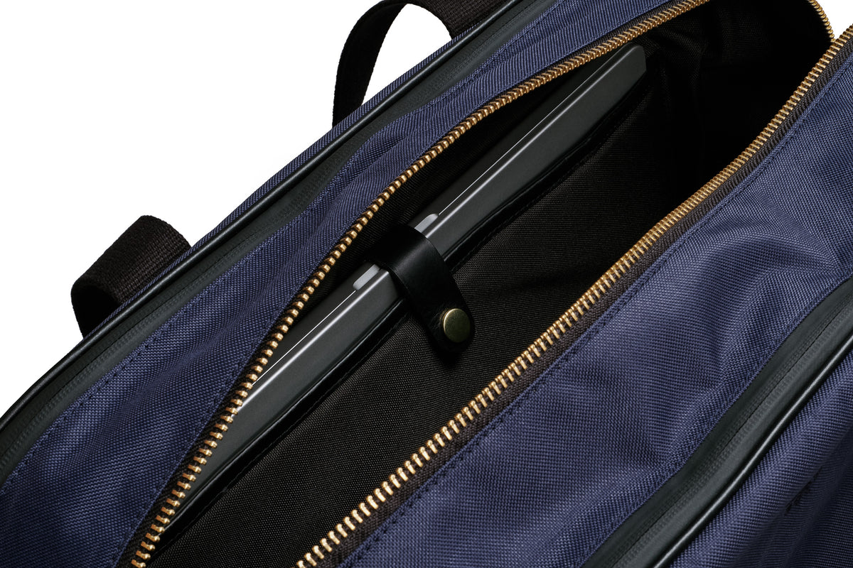 workout laptop bag in navy. go from the office to the gym in style.