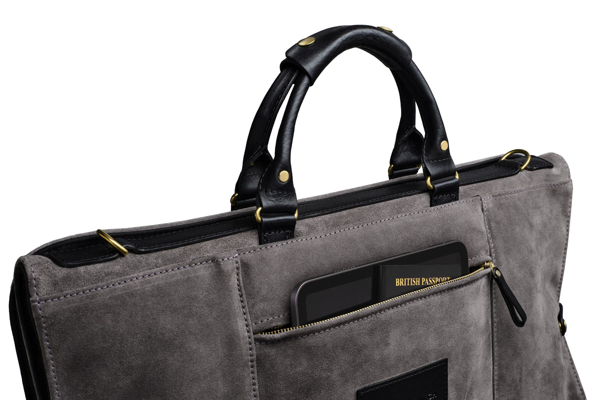 view of back storage pocket on the grey suede trifold