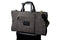 luxury grey suede trifold on top of a suitcase
