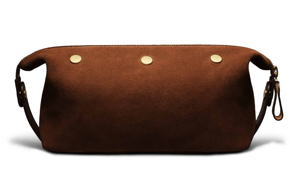 backside of quality brown suede dopp kit