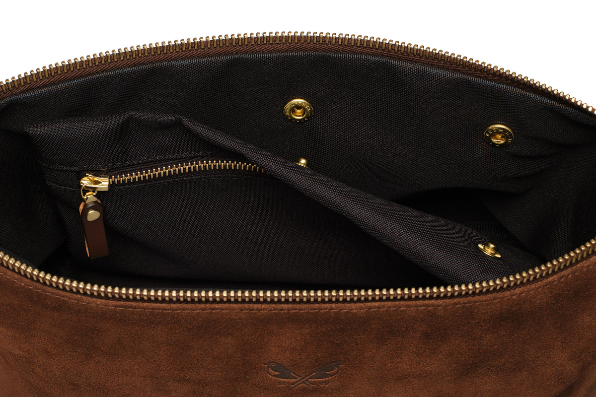 interior clip out wet compartment of brown suede toiletry bag