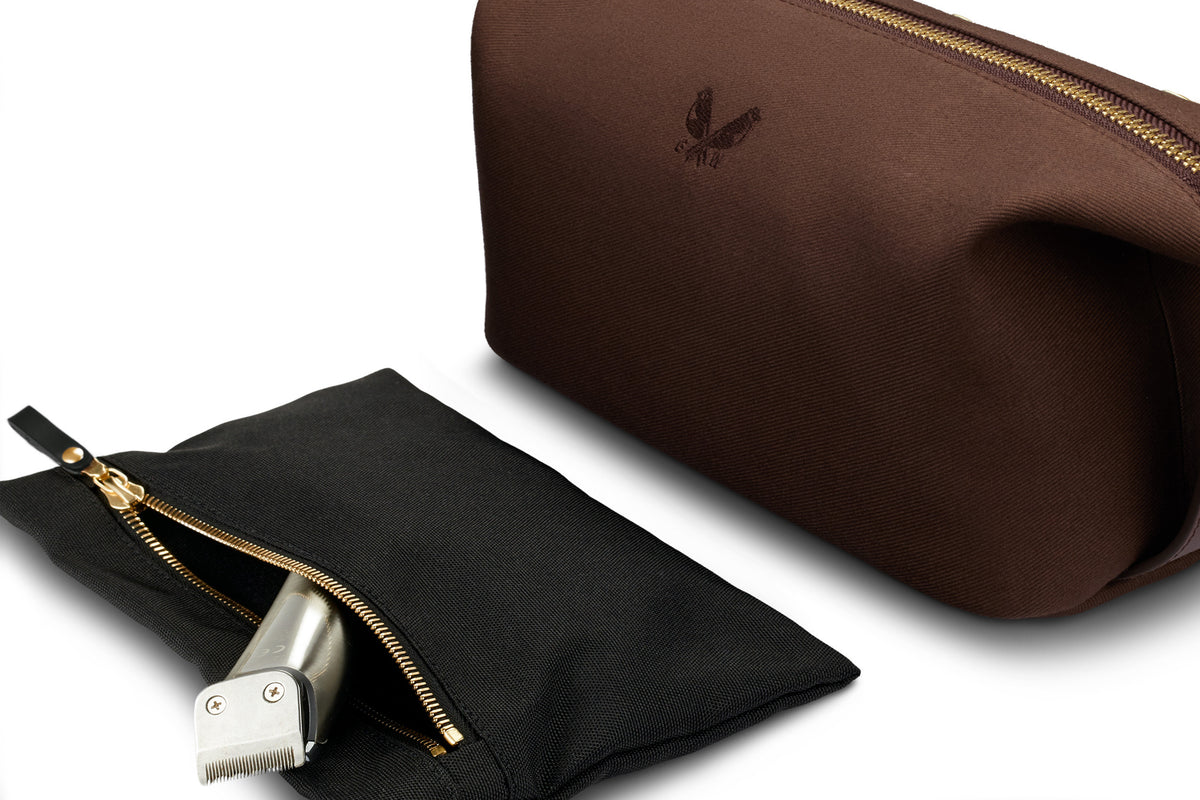 interior clip out wet compartment of brown canvas toiletry bag