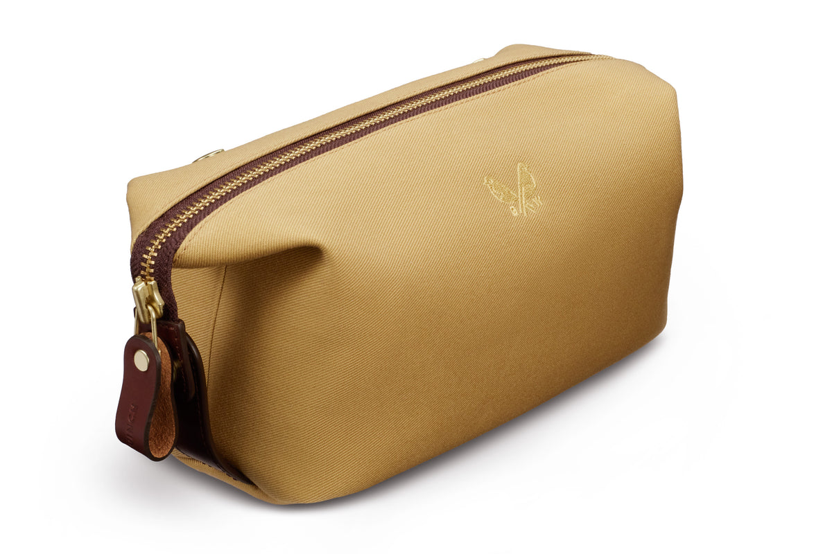 side view of tan toiletry bag