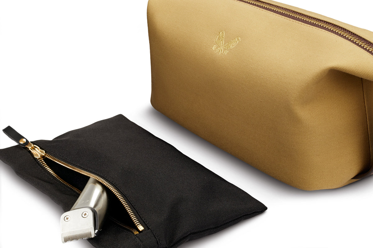 interior clip out wet compartment of tan canvas wash bag