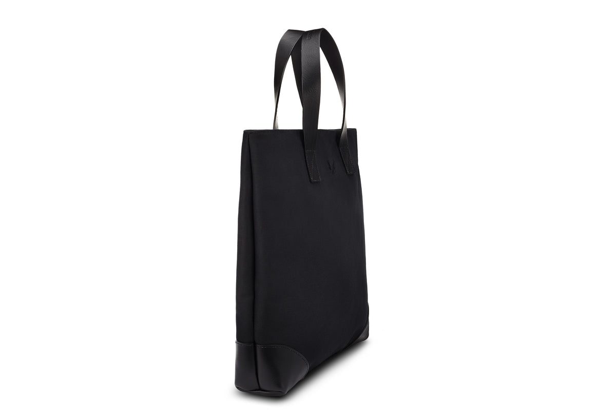 side view of slim black tote bag 