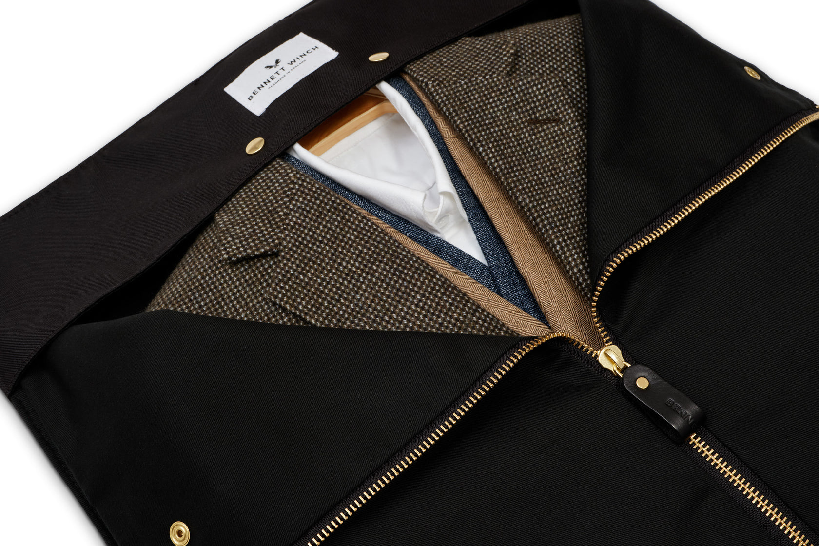 inside view of black trifold holding suits in the lining