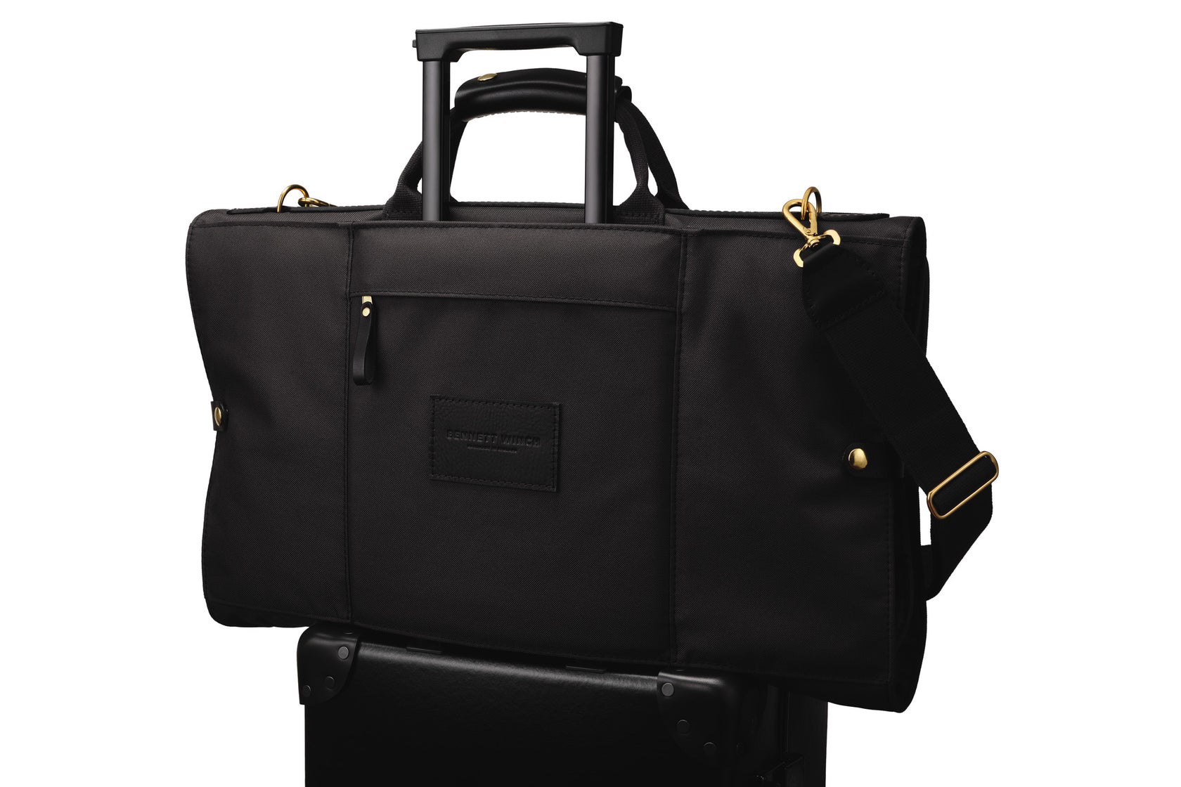 luxury trifold on top of a luggage