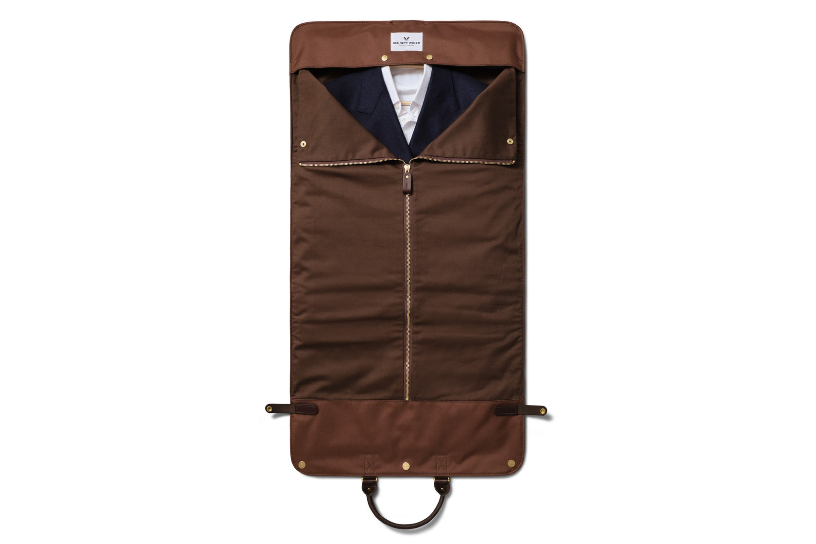 the trifold laid out zipped up with clothes inside