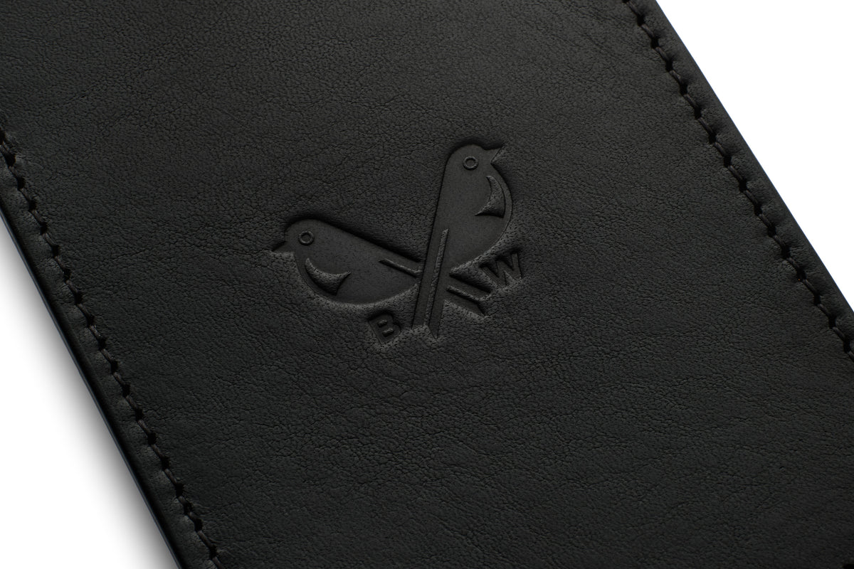 Close-up of the Bennett Winch logo on a black luggage tag.