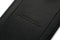 Close-up of "Bennett Winch" and "Handmade in London" embossed on the back of a black leather luggage tag.