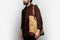 man wearing the bennett winch sand tote on his shoulder
