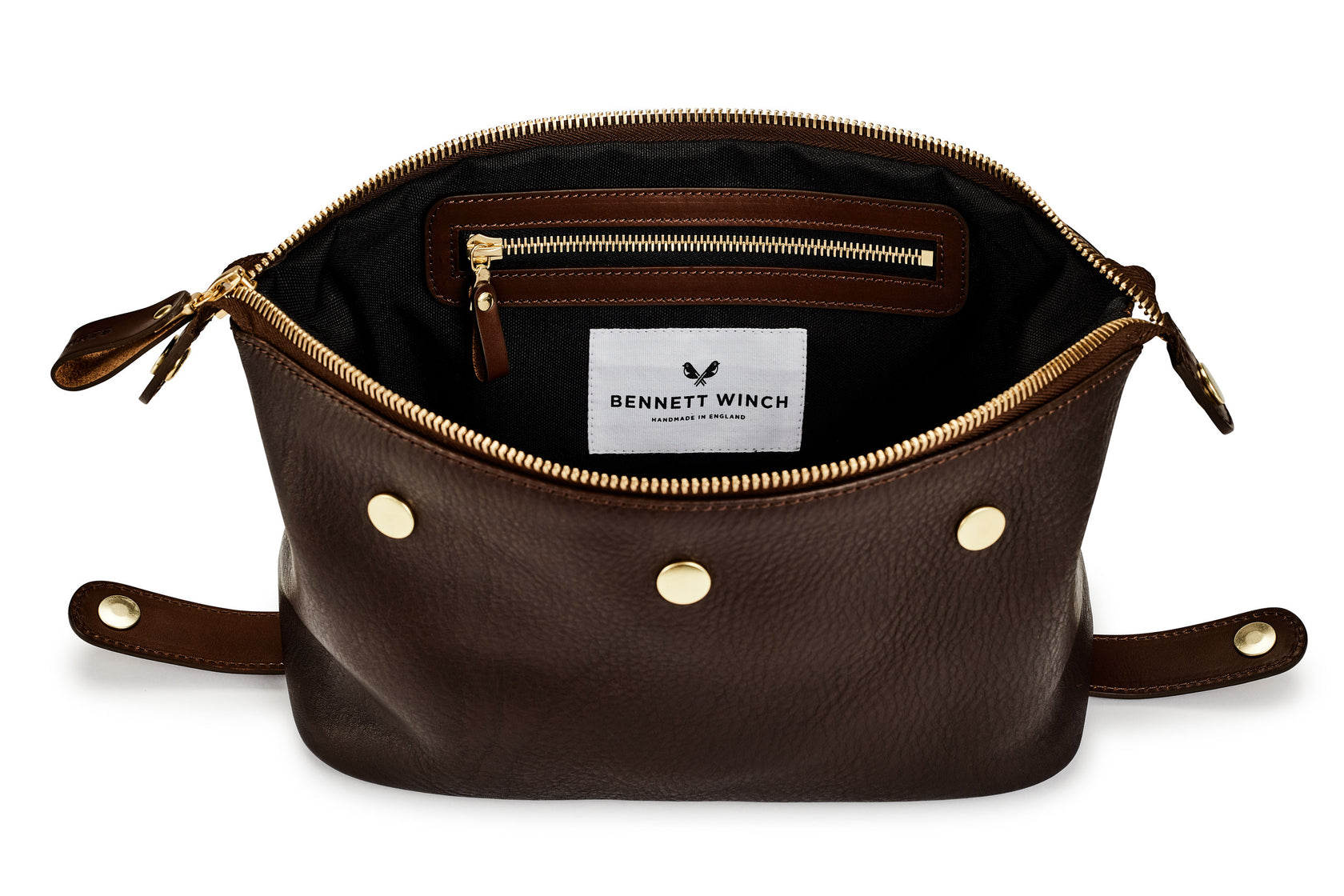 brown leather wash bag with a zipper inside 