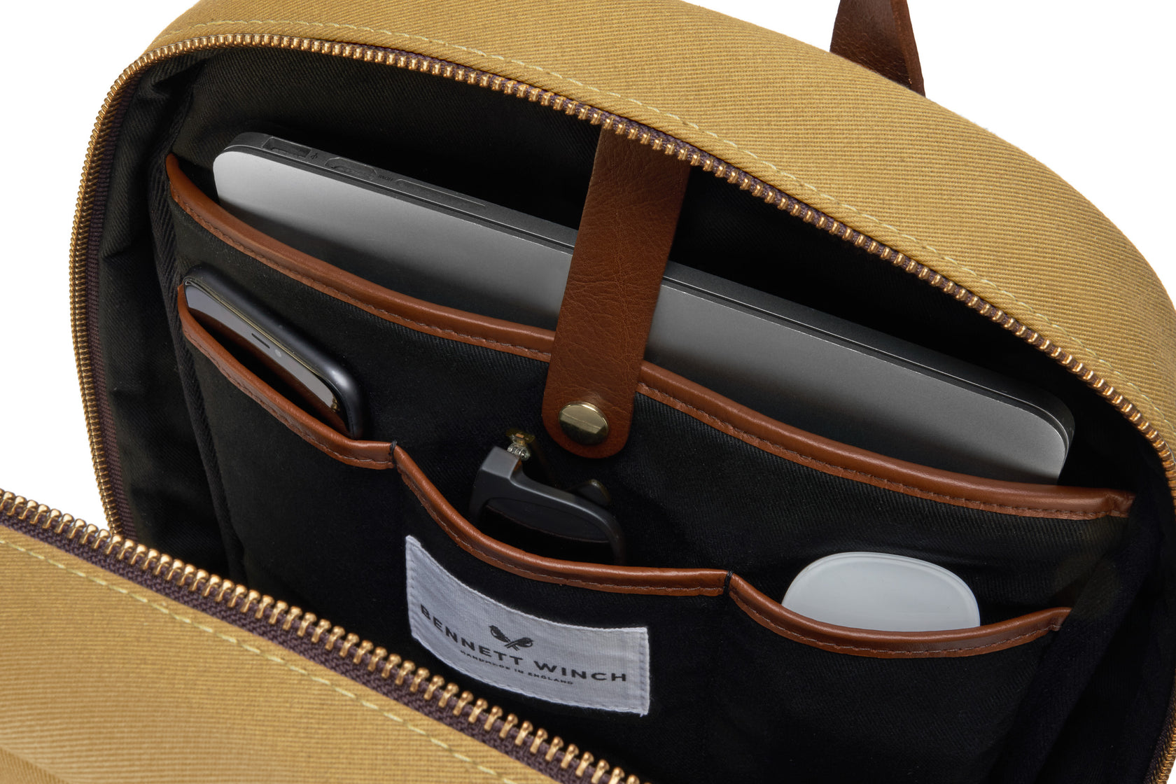 Close up on organizer compartments in sleek men's backpack