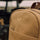 an action shot of the sand Bennett Winch backpack 