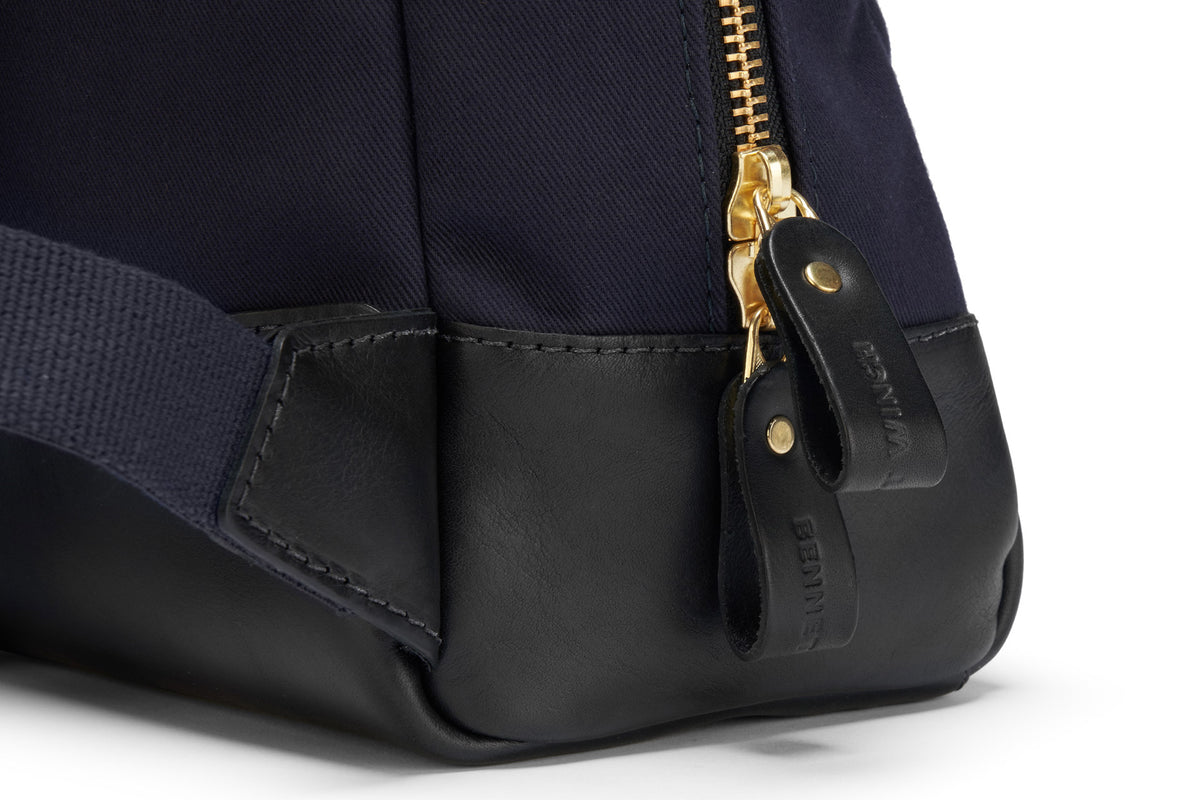 zip closure on luxury navy backpack