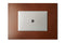 Italian veg tanned light brown leather desk blotter with a closed laptop on top