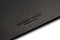 A shot showing the suede underside of the black leather desk blotter 