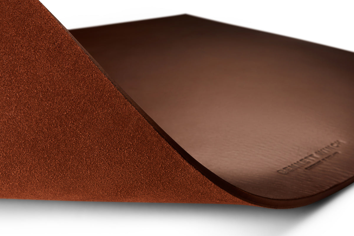 A shot showing the suede underside of the brown leather desk blotter 