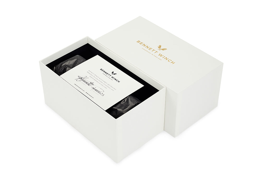 The white handmade gift box the triple watch roll arrives in