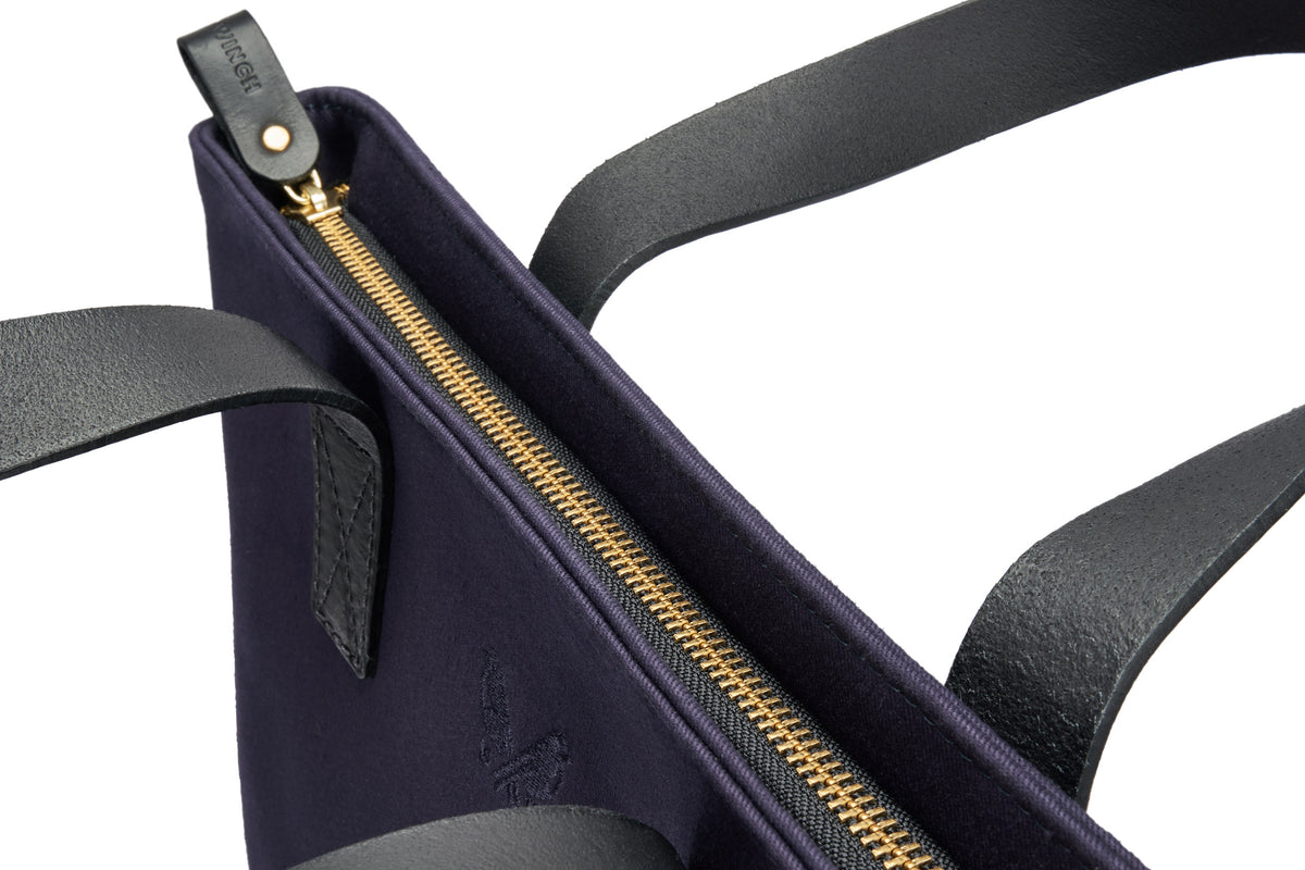quality zip closure on top of the navy tote 