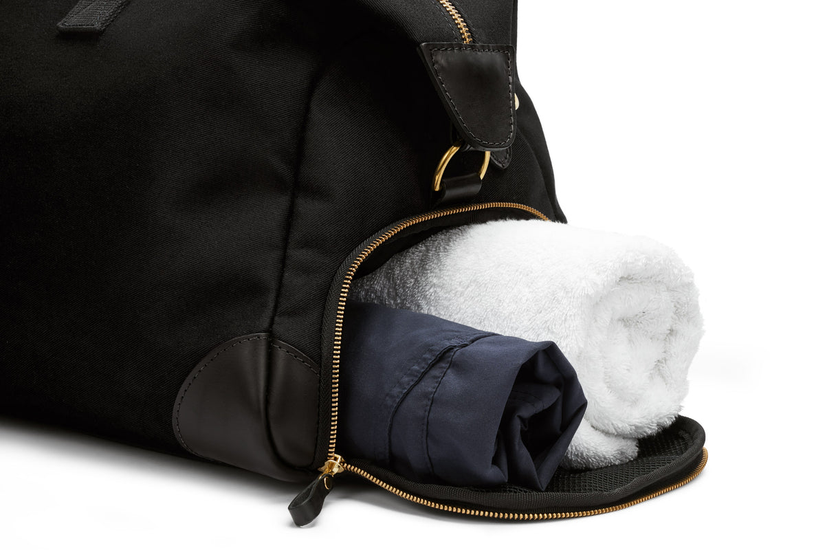 close up of the separate shoe compartment on the weekend bag